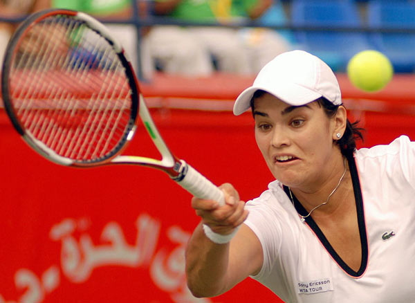 Eleni Danilidou, returns the ball to Na Li from China, during the first day of the Emirates Dubai Duty Free Women's Open tennis in Dubai Monday Feb. 19, 2007. Danilidou won the game 6-7, 7-6, 6-3.