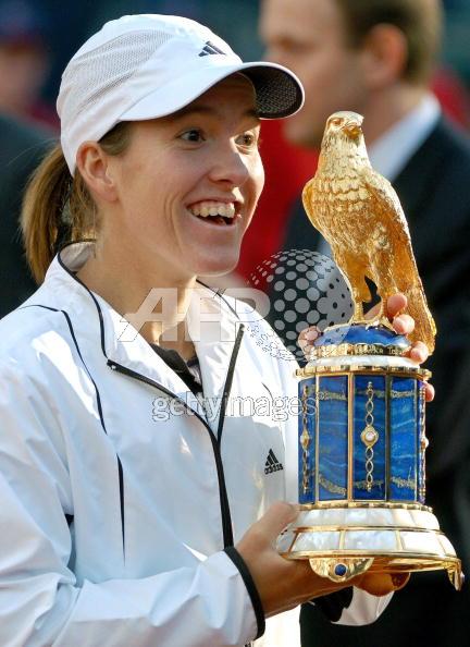 Justine Henin-Hardenne of Belgium presents her trophy after winning the Qatar Total German Open on May 8, 2005 in Berlin, Germany