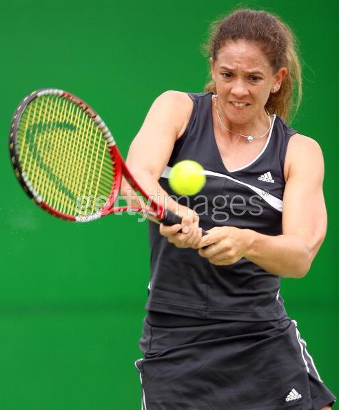 Patty Schnyder of Switzerland hits a backhand in her first round match against Eleni Daniilidou of Greece during day two of the Australian Open at Melbourne Park January 17, 2006 in Melbourne, Australia