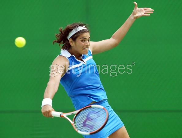 Eleni Daniilidou of Greece hits a backhand in her first round match against Patty Schnyder of Switzerland during day two of the Australian Open at Melbourne Park January 17, 2006 in Melbourne, Australia. (Photo by Mark Nolan/Getty Images) 