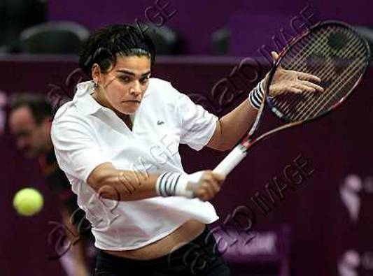 Eleni Daniilidou of Greece returns the ball to French player Marion Bartoli during their first round match at the 13th Paris WTA Tennis Open Gaz de France Tournament at Paris, Wednesday 09 February 2005. EPA/OLIVIER HOSLET