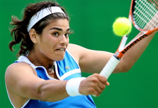 Eleni Daniilidou of Greece hits a backhand in her first round match against Patty Schnyder of Switzerland during day two of the Australian Open at Melbourne Park January 17, 2006 in Melbourne, Australia