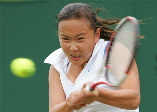 Shuai Peng of China returns the ball 