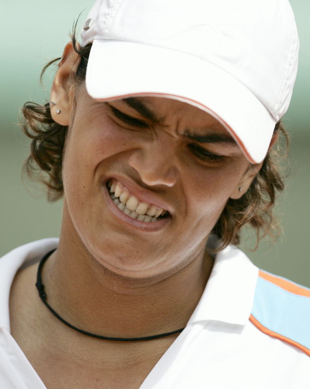 Eleni Danilidou grimaces as she faces Japan's Ai Sugiyama in their first round match during the French Open tennis tournament at the Roland Garros stadium in Paris, Sunday May 28, 2006