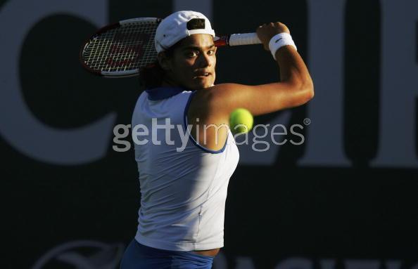 Eleni Daniilidou  hits a backhand against Maria Elena Camerin of Italy during her first round match at the Pacific Life Open tennis tournament in Indian Wells, California, March 8, 2006