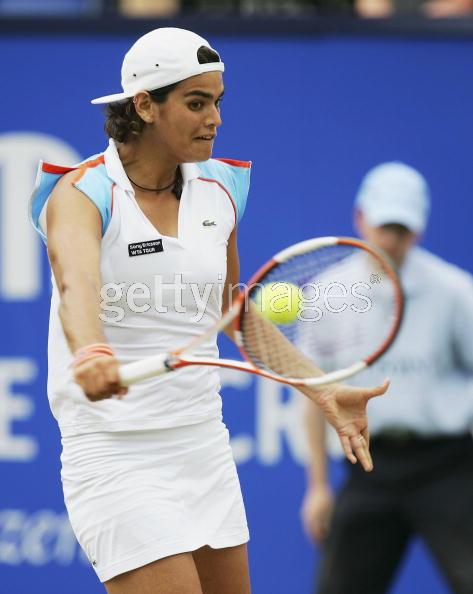 Eleni Daniilidou returns a shot to Zheng Jie  of China during the first round match of the Ordina Open tennis tournament in the Dutch town of Rosmalen June 19, 2006.