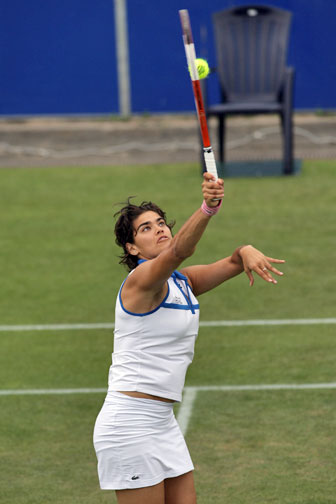 Eleni Daniilidou service the ball to Zheng Jie  of China during the first round match of the Ordina Open tennis tournament in the Dutch town of Rosmalen June 19, 2006. 