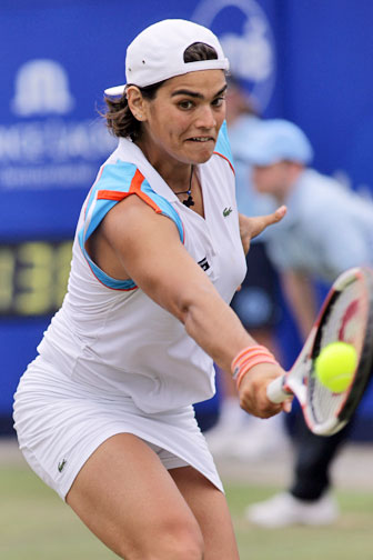 Eleni Daniilidou returns a shot to Dinara Safina of Russia during the semi-finals of the Ordina Open tennis tournament in the Dutch town of Rosmalen June 23, 2006. Eleni lost 3-6, 6-3, 4-6.