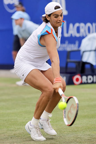 Eleni Daniilidou returns a shot to Dinara Safina of Russia during the semi-finals of the Ordina Open tennis tournament in the Dutch town of Rosmalen June 23, 2006. Eleni lost 3-6, 6-3, 4-6.