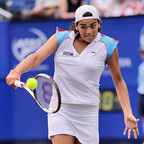 Eleni Daniilidou returns a shot to Dinara Safina of Russia during the semi-finals of the Ordina Open tennis tournament in the Dutch town of Rosmalen June 23, 2006. Eleni lost 3-6, 6-3, 4-6.