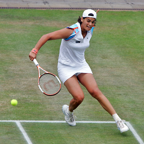 Eleni Daniilidou returns a shot to Dinara Safina of Russia during the semi-finals of the Ordina Open tennis tournament in the Dutch town of Rosmalen June 23, 2006. Eleni lost 3-6, 6-3, 4-6.