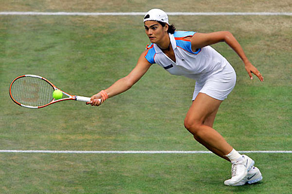 Eleni Daniilidou returns a shot to Dinara Safina of Russia during the semi-finals of the Ordina Open tennis tournament in the Dutch town of Rosmalen June 23, 2006. Eleni lost 3-6, 6-3, 4-6.