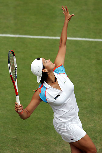 Eleni Daniilidou service the ball to Dinara Safina of Russia during the semi-finals of the Ordina Open tennis tournament in the Dutch town of Rosmalen June 23, 2006. Eleni lost 3-6, 6-3, 4-6.