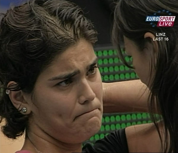 Eleni Daniilidou (R) of Greece receives medical treatment during her second round tennis match against Maria Sharapova of Russia at the Generali Linz tennis tournament in Linz October 26, 2006. 