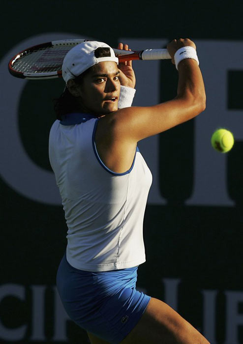 Eleni Daniilidou  hits a backhand against Maria Elena Camerin of Italy during her first round match at the Pacific Life Open tennis tournament in Indian Wells, California, March 8, 2006