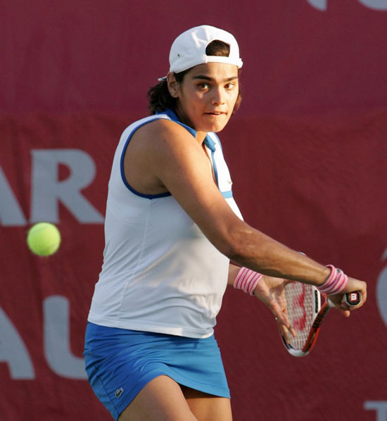 Eleni Daniilidou of Greece returns the ball to Anabel Medina Garrigues of Spain during the second day of the WTA Qatar Open tennis tournament in Doha February 28, 2006