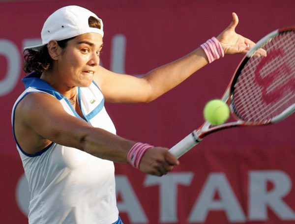 Eleni Daniilidou of Greece returns the ball to Anabel Medina Garrigues of Spain during the second day of the WTA Qatar Open tennis tournament in Doha February 28, 2006